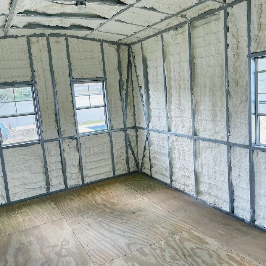 Closed-cell spray foam insulation applied to wall cavities in a residential project in Holdrege